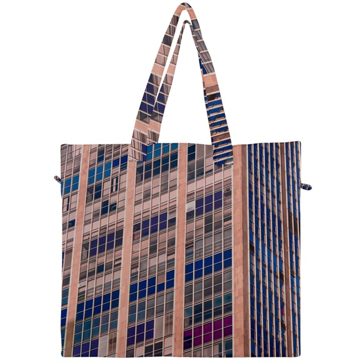 Low Angle Photography Of Beige And Blue Building Canvas Travel Bag