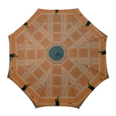 Person Stands By Tall Orange Wall And Looks- Up Golf Umbrellas by artworkshop