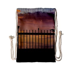 Small Bird Over Fence Backlight Sunset Scene Drawstring Bag (small) by dflcprints